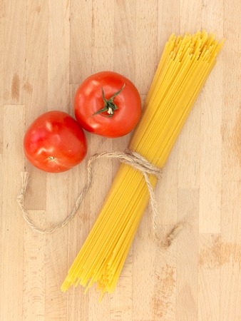 A close up shot of spaghetti pasta and tomatoesの写真素材
