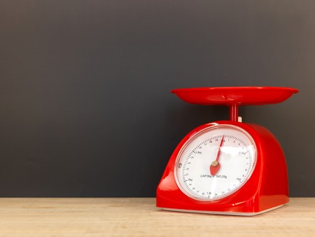 A close up shot of a set of food scalesの写真素材