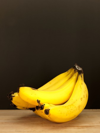 Assorted fruit placed on a wooden surfaceの写真素材