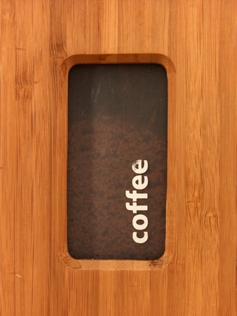Wooden tea and coffee canisters up closeの写真素材