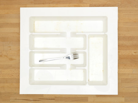 A close up shot a cutlery draw divider