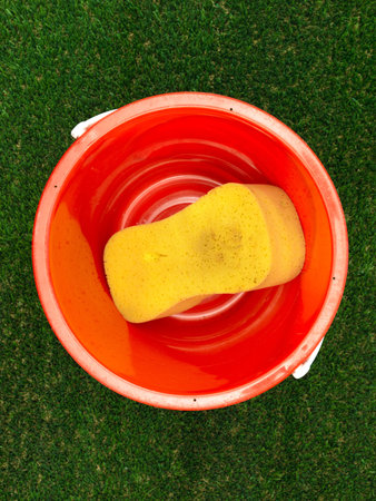 Car wash cleaning equipment on artificial grassの写真素材