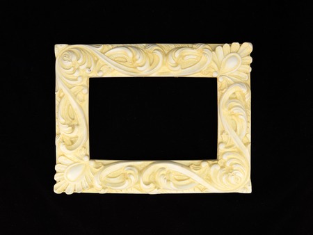 A photo frame on a wooden shelfの写真素材
