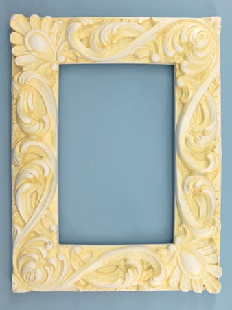 A photo frame on a wooden shelfの写真素材