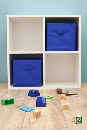 A studio photo of a simple white bookcaseの写真素材