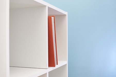 A studio photo of a simple white bookcaseの写真素材