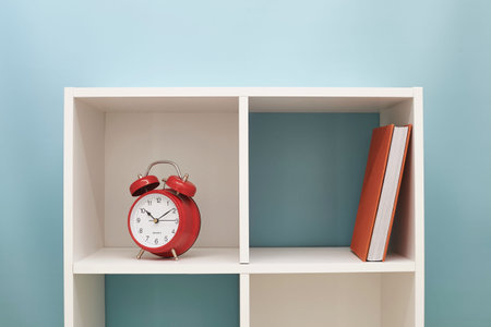 A studio photo of a simple white bookcaseの写真素材