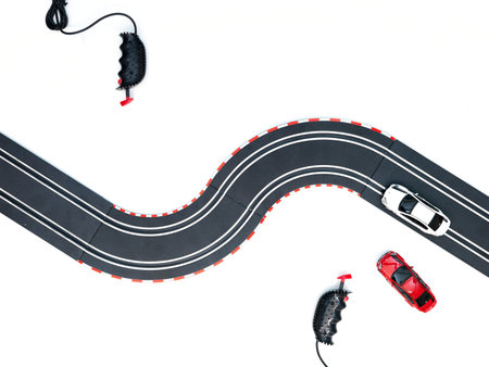A studio photo of a slot car race set