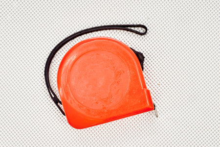 An industrial photo of a tape measure