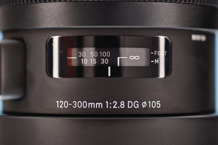 A studio photo of a modern telephoto zoom lens