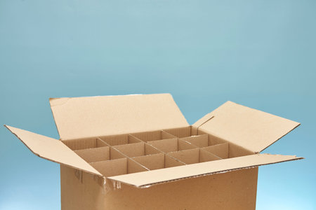 A studio photo of a cardboard wine box