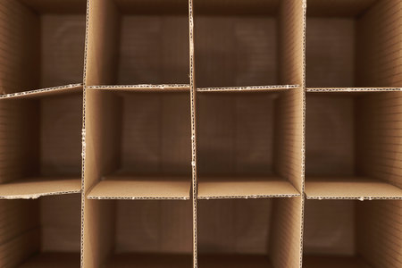 A studio photo of a cardboard wine box
