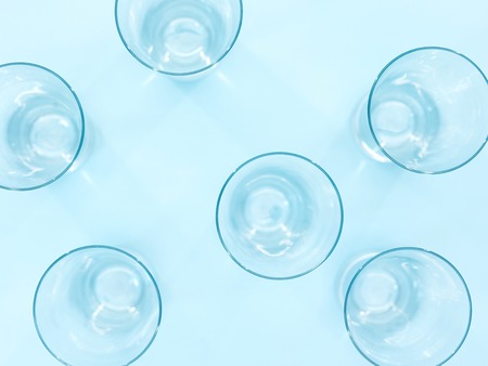 A studio photo of a tall water glassの写真素材