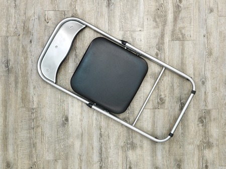 A studio photo of a black fordable chairの写真素材