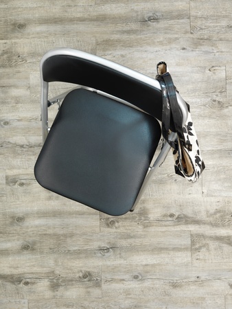 A studio photo of a black fordable chairの写真素材