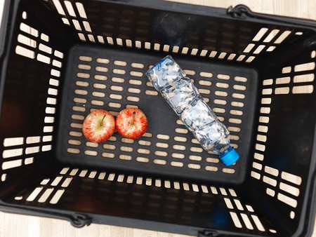 A photo of a black shopping basketの写真素材