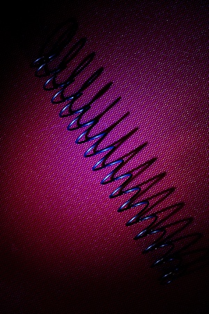 A studio photo of a metal springの写真素材
