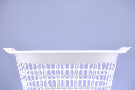 A studio photo of a laundry washing basketの写真素材