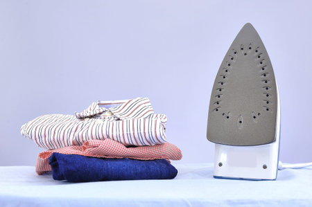 A studio photo of ironing and laundry items