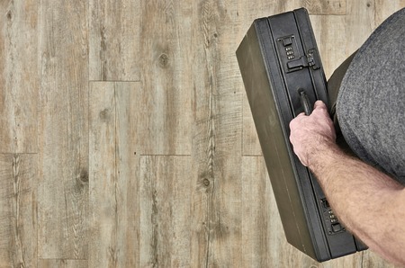 A studio photo of an old leather briefcaseの写真素材
