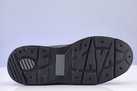 A studio photo of black walking shoesの写真素材