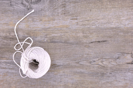 A studio photo of a ball of string