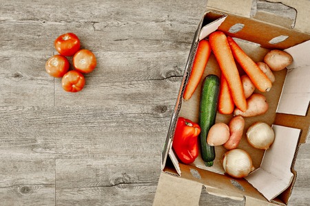 A studio photo of a fruit and vegetable boxの写真素材