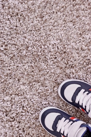 A studio photo of kids shoesの写真素材