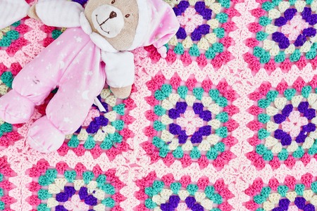 A studio photo of a hand made knitted blanketの写真素材