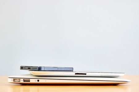 A laptop computer on a wooden deskの写真素材