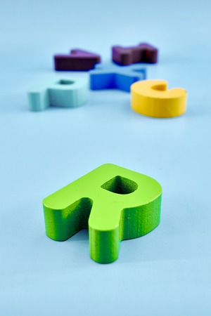 A studio photo of wooden alphabet lettersの写真素材