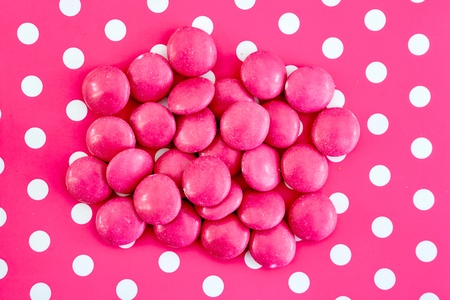 A studio photo of a pink polka dot backgroundの写真素材