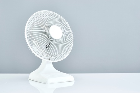 A studio photo of a portable electric fanの写真素材