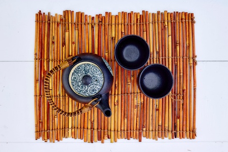 A studio photo of a black tea potの写真素材