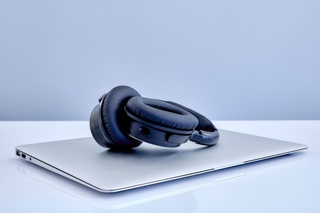 A laptop computer on a wooden deskの写真素材