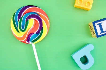 A studio photo of a candy swirl lollypopの写真素材