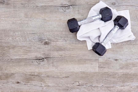 A studio photo of a black gym dumbbellの写真素材