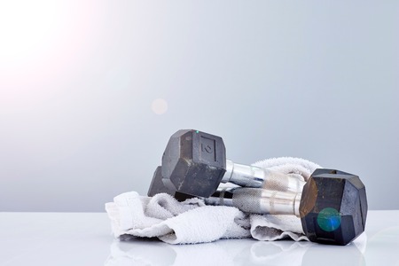 A studio photo of a black gym dumbbellの写真素材