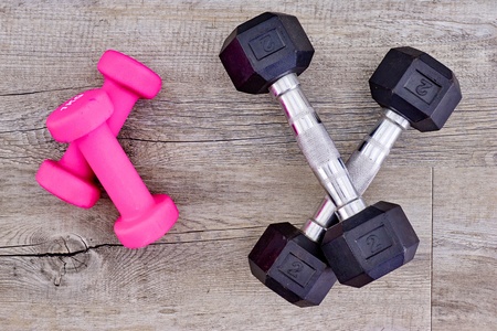 A studio photo of a pink gym dumbbellの写真素材