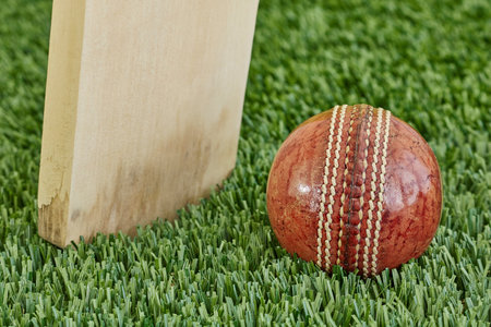 A studio photo of cricket gear on grassの写真素材