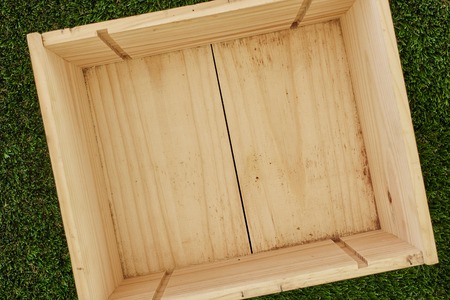 A studio photo of an empty pine boxの写真素材