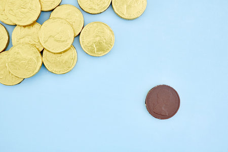 A studio photo of chocolate gold coinsの写真素材