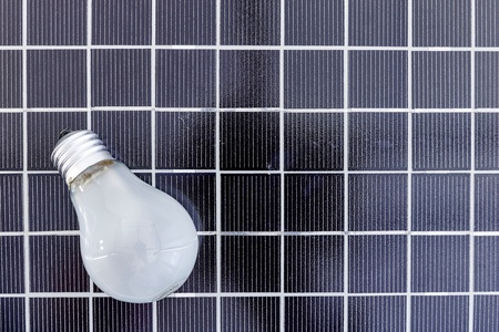 A studio photo of a screw in light bulbの写真素材