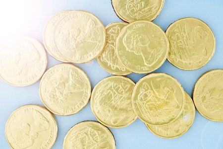 A studio photo of chocolate gold coinsの写真素材