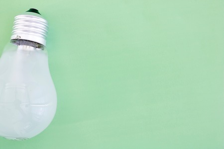 A studio photo of a screw in light bulbの写真素材