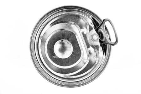 A studio photo of a metal can lid