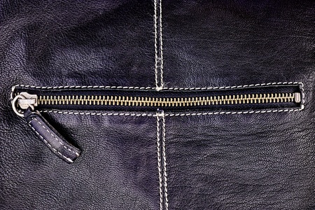 A studio photo of a ladies hand bag zipperの写真素材