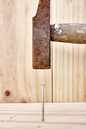 A studio photo of nailing into woodの写真素材