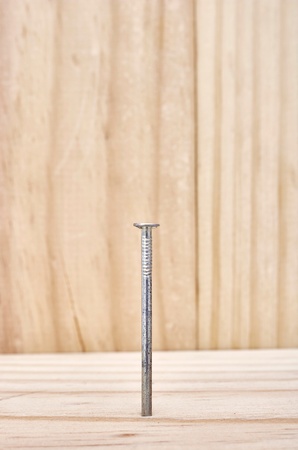 A studio photo of nailing into woodの写真素材