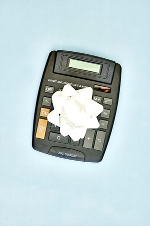 A studio photo of an electronic business calculatorの写真素材